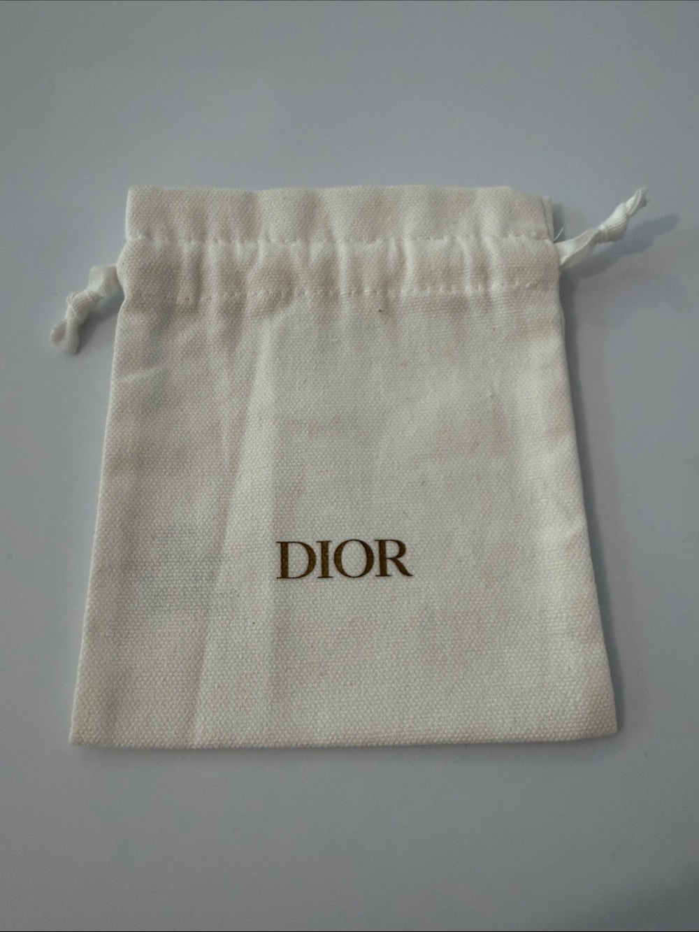 Dior Cream Drawstring Pouch with Gold Logo
